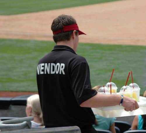 Vendor Serving Food in a Baseball Stadium Best Baseball Stadium Foods